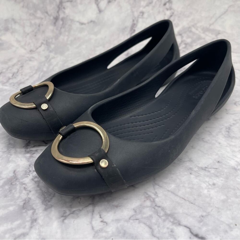 Crocs, Iconic Comfort. Black Women's Flats with Gold Accent. Size 6.